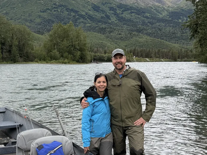 Gina and Doug Wall beside their drift boat on the Kenai River