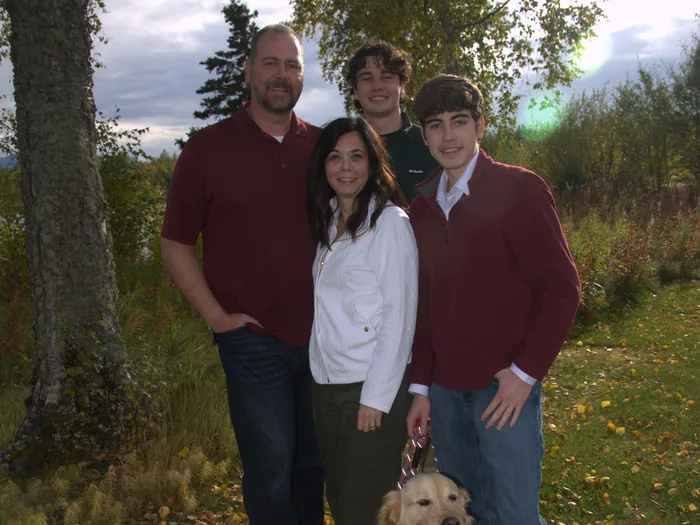 The Wall family outdoors with their golden retriever