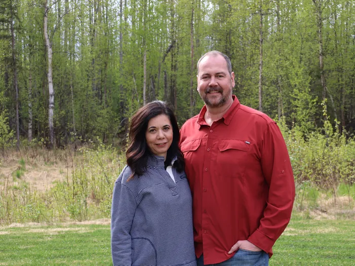 Gina and Doug Wall outdoors in Chugiak in the spring